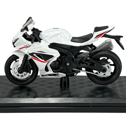 1:18 scale white Suzuki GSX-R1000 diecast model motorcycle left side view on display stand