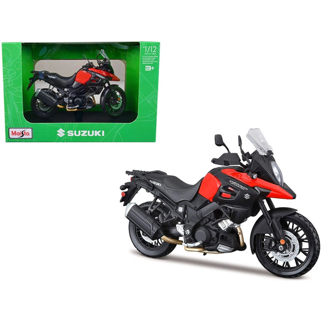 https://cdn.shopify.com/s/files/1/0504/9925/6496/files/suzuki-v-strom-1000-red-and-black-with-plastic-display-stand-112-diecast-motorcycle-model-by-maisto-562256.jpg?v=1760624522