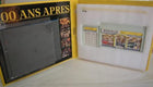 Renault model car display set in yellow packaging, includes diorama pieces and booklet.