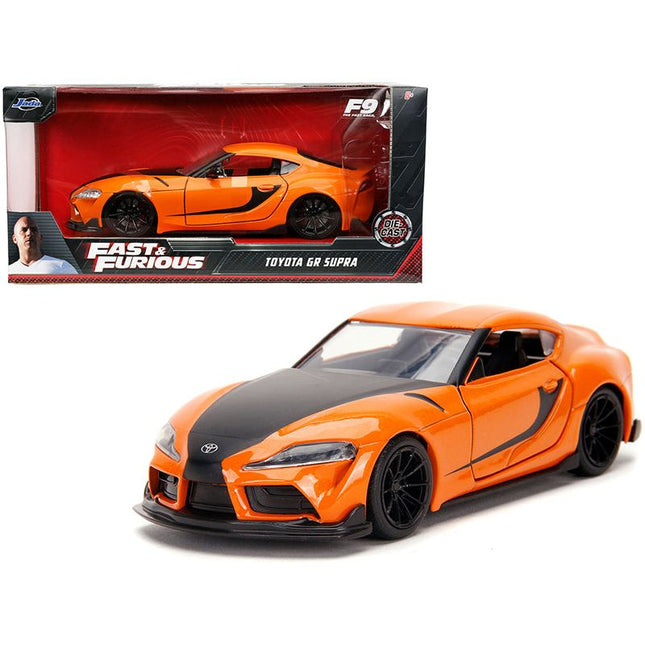 https://cdn.shopify.com/s/files/1/0504/9925/6496/files/toyota-gr-supra-orange-with-black-stripes-fast-furious-9-f9-2021-movie-132-diecast-model-car-by-jada-795027.jpg?v=1748419233