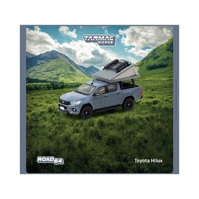 https://cdn.shopify.com/s/files/1/0504/9925/6496/files/toyota-hilux-pickup-truck-rhd-right-hand-drive-gray-with-camping-equipment-road64-series-164-diecast-model-car-by-tarmac-works-182930.jpg?v=1748405014