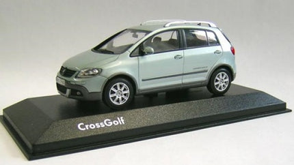 1:43 scale VW Cross Golf 5 diecast model car in ice silver metallic, side view on display stand