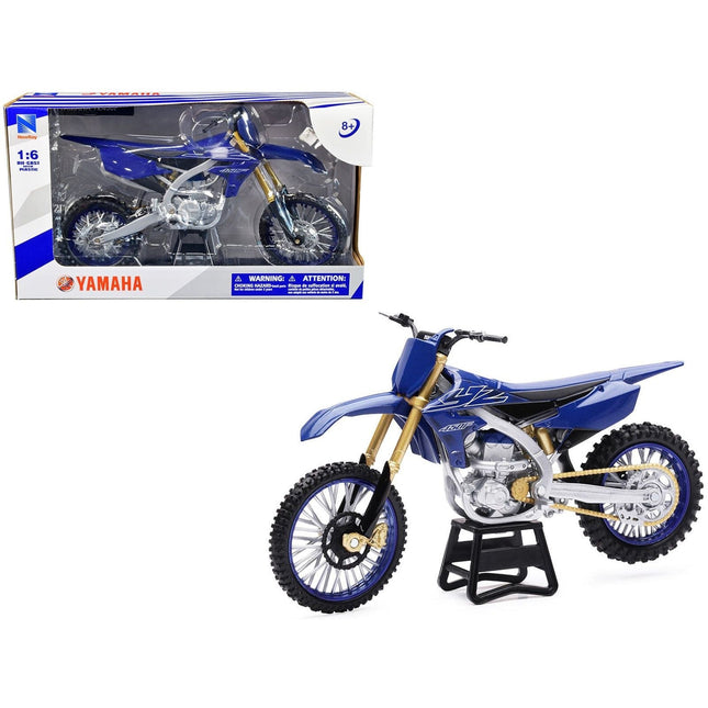 https://cdn.shopify.com/s/files/1/0504/9925/6496/files/yamaha-yz450f-dirt-bike-motorcycle-blue-and-black-16-diecast-model-by-new-ray-129722.jpg?v=1760624557