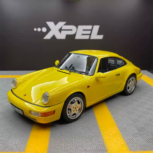 Norev Porsche 911 Carrera 4 Silver 1:18 Diecast Model Car - studio product photo of the scale model
